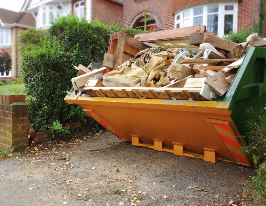 Loaded skip on a residential driveway