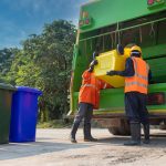 Men disposing of waste.